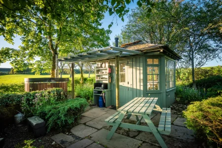 Summer Howf with outdoor seating and wood-fired hot tub at Craighead Howfs in Perthshire